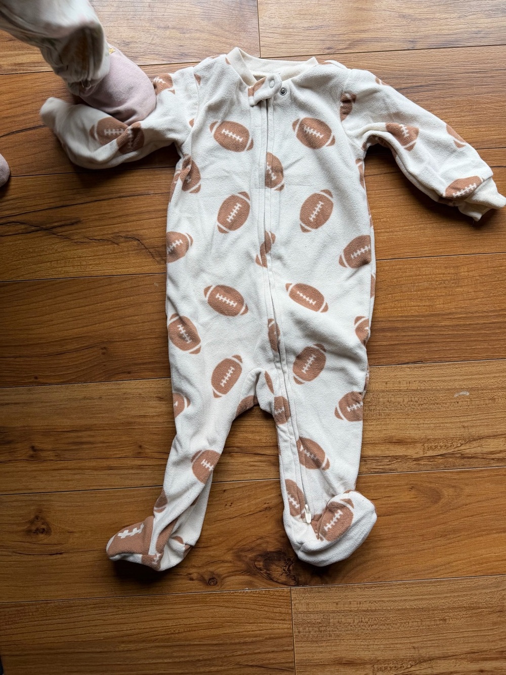 6-9 months Carter's Cream Fleece One-Piece with Footballs